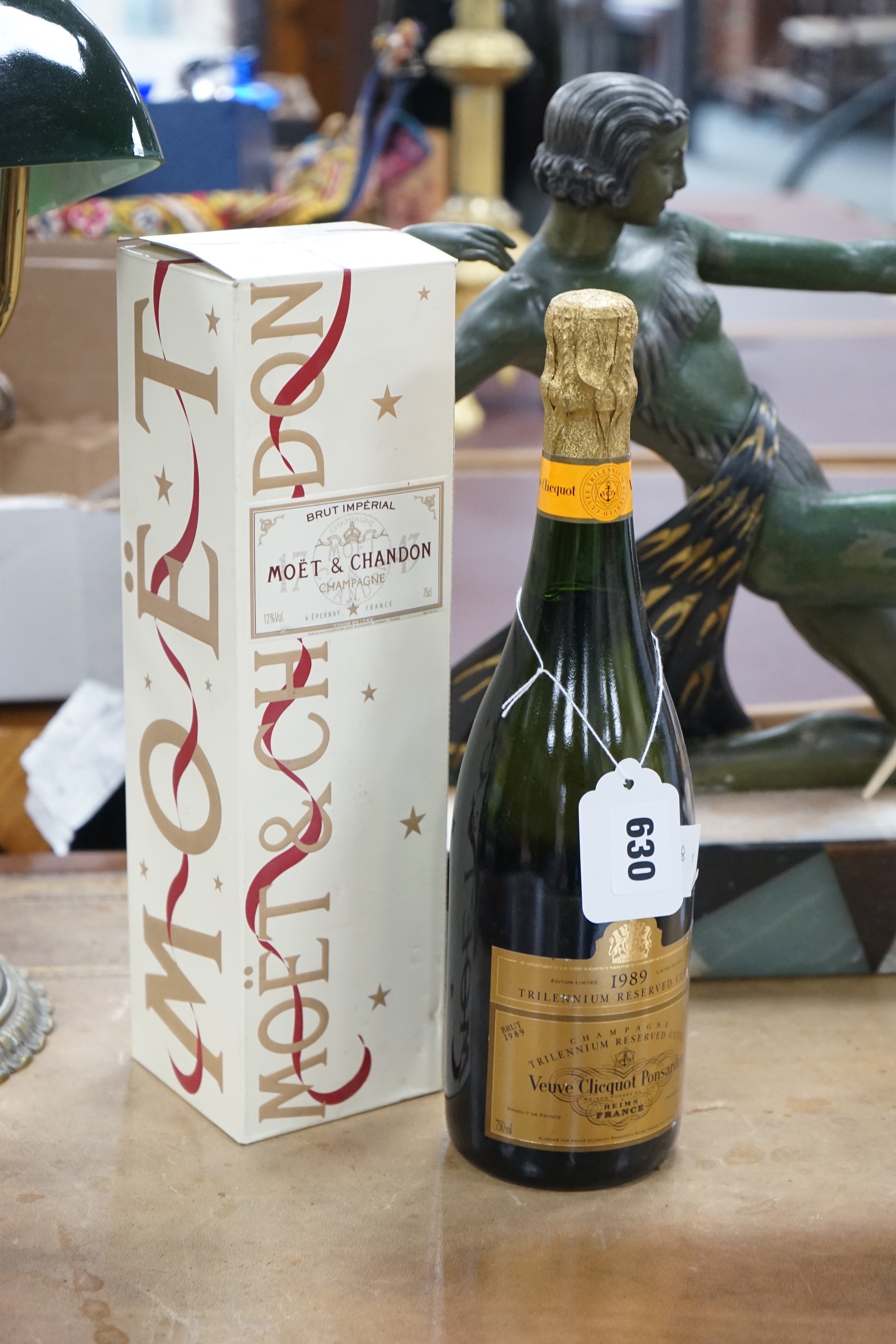 A 1989 bottle of Veuve Cliquot Ponsardin, together with a boxed bottle of Brut Moët & Chandon